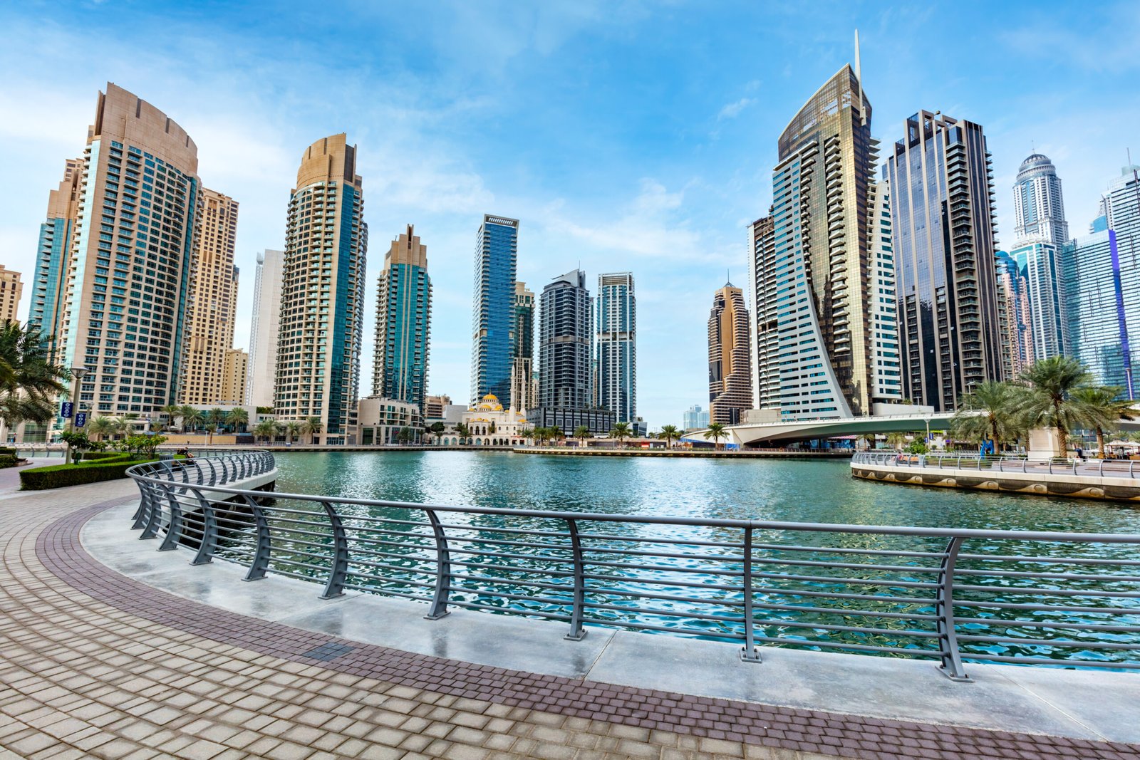 Dubai marina promenade in UAE. Highrise residential buildings, business skyscrapers