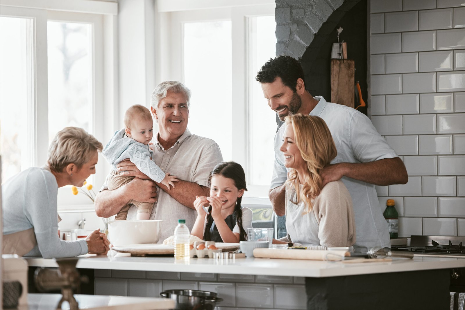 family cooking together in bright kitchen