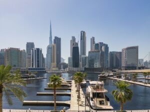 View of Dubai skyline including the Burj Khalifa, the world's tallest skyscraper as seen from Business Bay Marina in downtown Dubai